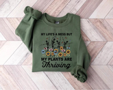 Women’s Crewneck Sweatshirts - Life’s a mess but my Plants are Thriving Hippo Boutique