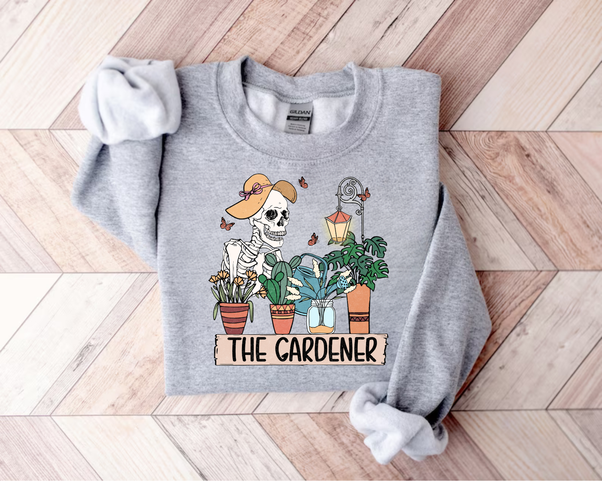 Women’s Crewneck Sweatshirts - The Gardener Skeleton Hippo Boutique