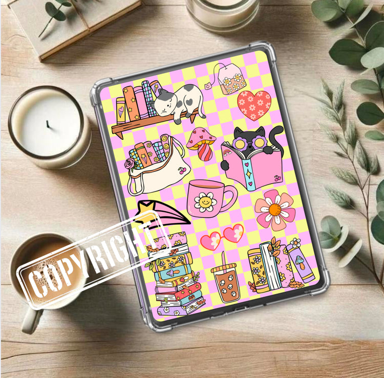 Kindle insert with retro cat, books, flowers, and teacup on pink and yellow checkered background. - Kindle Insert - Cute Retro Bookish Cat