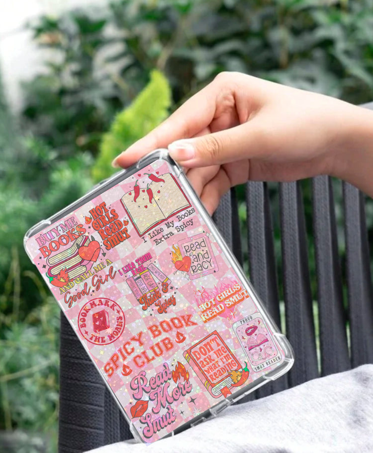 Pink Kindle insert with colorful smut romance book-themed designs and playful text in a clear protective case. - Kindle Insert - Smut Romance