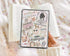 Handmade brown checkered Kindle insert with organic, comfortable bookish-themed stickers on cozy fabric background. - Kindle Insert - Brown Checkered Bookish