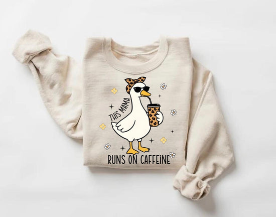mama runs on caffeine, mama shirt, funny mom shirt, goose shirt, goose sweatshirt, goose hoodie, mom life shirt, tired mom outfit, caffeine lover mom, funny mom gift, cute goose design, trendy mom shirt, aesthetic mom tee, coffee mom shirt, mom sweatshirt, mom hoodie, gift for mom, motherhood humor, comfy mom outfit, viral mom shirt