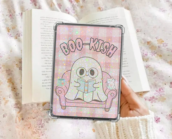 Glossy Kindle insert with pastel ghost reading a book, pink "Boo-kish" text, and floral background. - Kindle Insert - Ghost Bookish