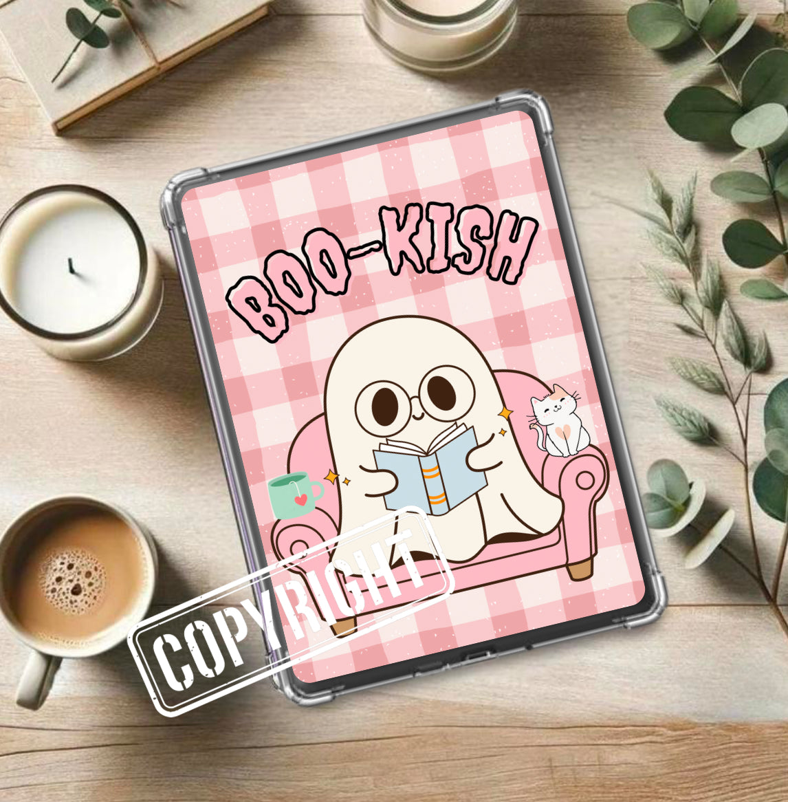 Pink gingham Kindle insert with a cute ghost reading on a couch and the text BOO-KISH in playful font. - Kindle Insert - Ghost Bookish